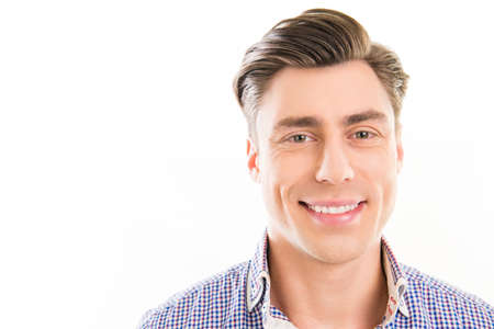 Close up photo of young happy smiling man om white background