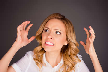 Close up photo of angry young woman showing handsの写真素材