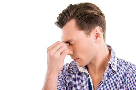 Close up portrait of sad businessman feeling strong pain in head