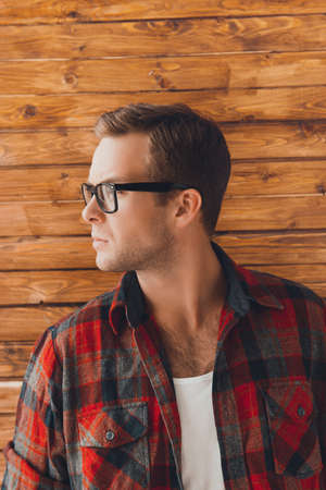 Close up portrait of pretty man in checkered red shirt and glassesの写真素材