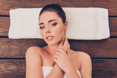 Sensitive pretty woman  having procedures in spa salonの写真素材