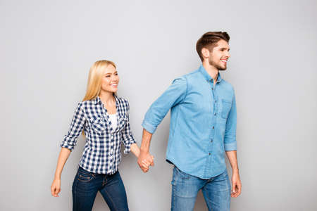 follow me! cute and happy young couple going to their happy dreamy future