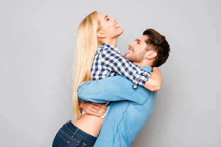 Portrait of two happy lovers embracing and laughingの写真素材