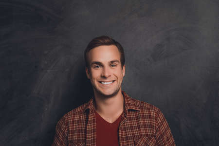 Portrait of handsome happy young man with beaming smileの写真素材