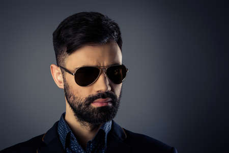 Portrait of brutal handsome man in jacket and spectaclesの写真素材