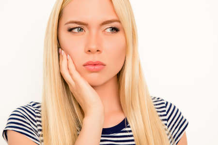 Portrait of upset sick woman feeling strong pain in cheek