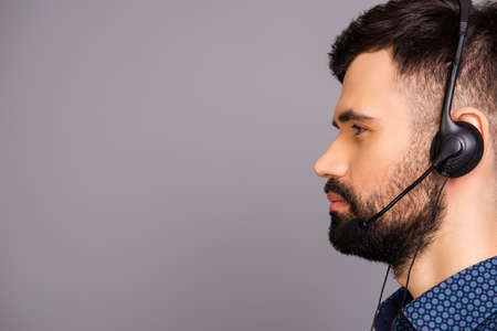 A closeup side-face portrait of a young agent of call centreの写真素材