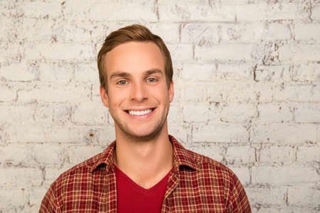 Portrait of cheerful happy man with beaming smile