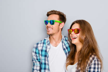 Portrait of excited young cheerful man and woman in spectaclesの写真素材