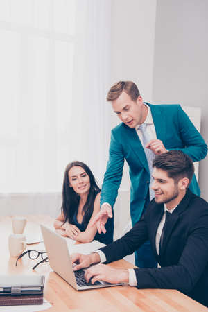 Executive businessman giving advices to his colleagues about project