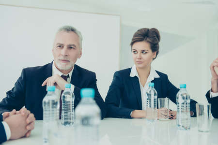 Portrait of confident businessman and woman  planning strategy of company