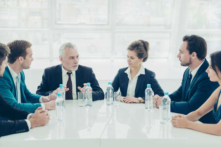 Group of colleagues planning future work at meeting in office