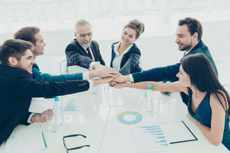 Teamwork concept. Business people joining hands in circle