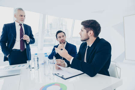 Portrait of business people discussing new financial projectの写真素材