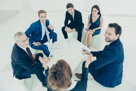 Team of company managers discussing plans during office meetingの写真素材