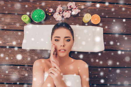 Sensual woman with perfect skin relaxing in sauna on winter backgroundの写真素材