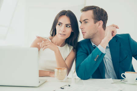 Young business woman showing smth to her colleague in officeの写真素材