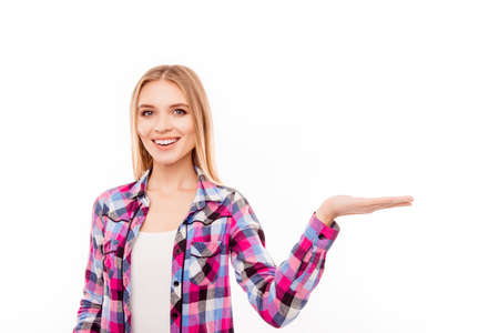 Cheerful pretty woman making advertisement of new productの写真素材