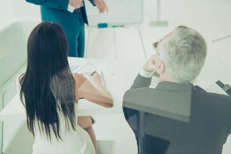 Back view of businesspeole on seminar listening speakerの写真素材