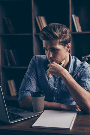 Portrait of young minded man thinking about taskの写真素材