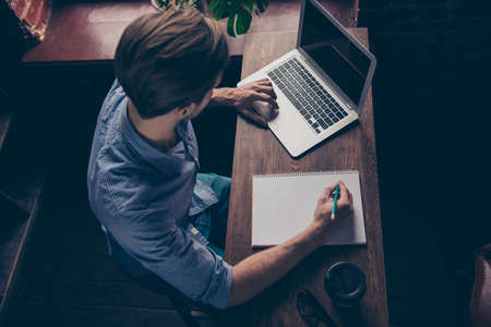 Top view of young manager at office engaged  in working processの写真素材