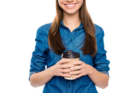 Close up photo cheerful happy woman holding cup of coffeeの写真素材