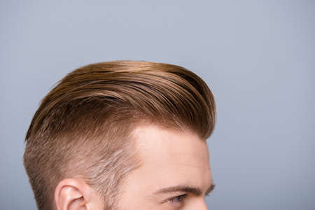 Cropped photo portrait of man's head with health hair and stylish haircutの写真素材