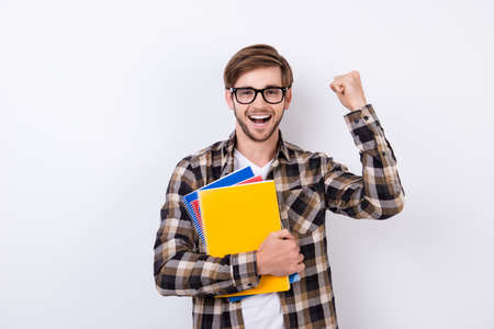 Yes! Happy handsome student in spectacles having an exelent mark for exam.の写真素材