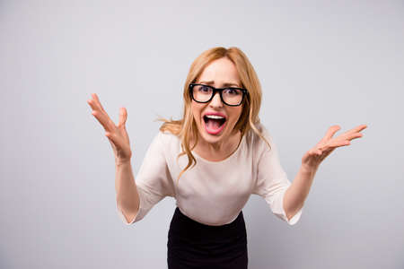 Nervous angry businesswoman shouting on the screenの写真素材