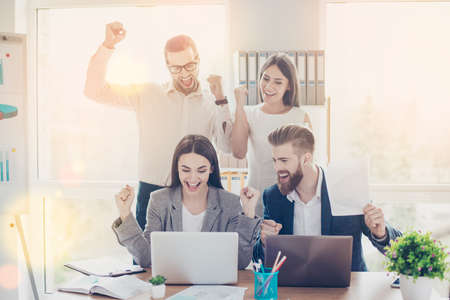 great job this is a brekthrough cheerful businesspeople triumphing because of the success they...