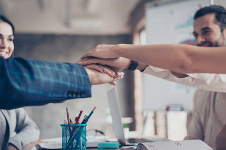 Concept of business agreement.  Close up photo of people holding hands togetherの写真素材