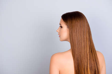 Health and beauty harmony and care advertising. Half face cropped portrait of young attractive lady with brown hair and smooth skinの写真素材