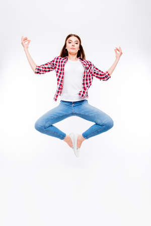 Wellbeing, wellness, vitality, peace lifestyle. Young hipster female student is practicing yoga,...