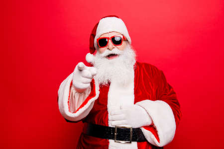 Cool funny playful naughty Santa Claus grandfather fooling aroundの写真素材