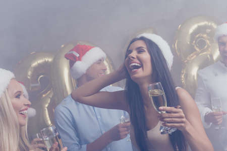 Closeup cropped of amazed brunette in festive crowd of youth on luxury feast, in classy outfits, so...