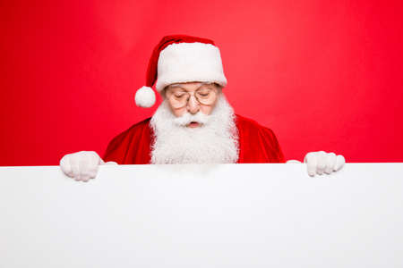 Omg! Increadible unexpected unbelievable crazy december surprise time! Holly jolly x mas noel! Closeup of aged excited astonished santa with wide open eyes, mouth looking down at emptyの写真素材