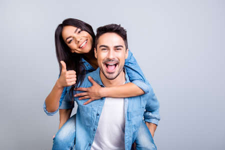 excited two people in love is having fun, they adore each other. Pretty joyful lovely smiling woman...