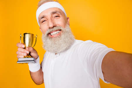 Body, health, care, champ, fit, leisure, training, workout, happiness, leadership, motivation, pride, success lifestyle. Emotional cool grandpa with reward, sign of respect, hero, strength, powerの写真素材