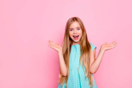 Happy beautiful surprised cute lovely charming small girl with open mouth and toothy smile