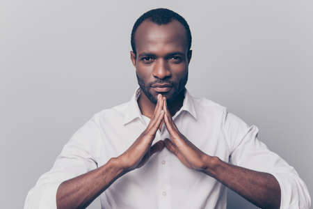 Keep calm and peace be yourself! Portrait of confident serious thoughtful pensive freelancer trying to find balance wearing white classic shirt isolated on gray backgroundの写真素材