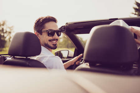 Bachelor single masculine lifestyle, happiness, enjoy escape, reach destination. Close up cropped back rear view shot of carefree successful romantic dreamy well dressed stylish driver in specsの写真素材