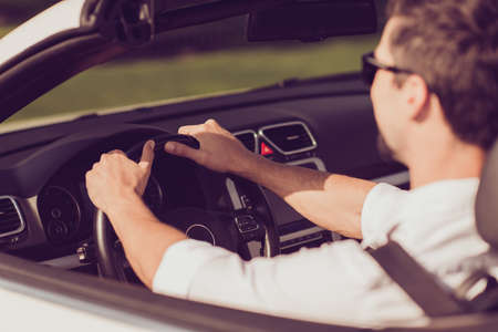 Happiness, enjoy escape, reach destination, bachelor single masculine lifestyle. Close up cropped back rear view shot of carefree successful romantic dreamy well dressed driver in specsの写真素材