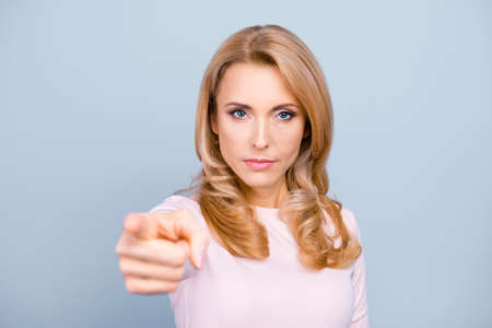 You annoy me! Close up portrait of serious strict aggressive nervous stressed woman pointing on...