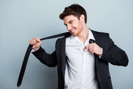 Upset, displeased, dissatisfied guy tear off closes, tie, shirt after bad, hard, working day, having problem, trouble at workの写真素材