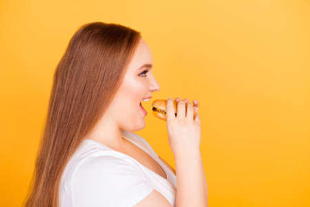 Side profile half-faced photo of excited cheerful joyful woman, she is going to eat tasty savory...