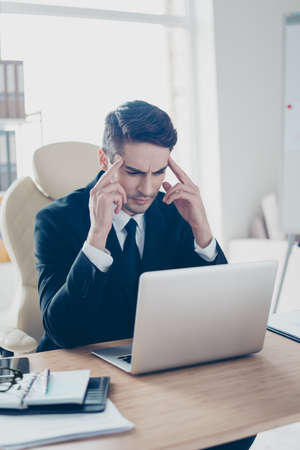 Vertical portrait of serious sad upset troubled feeling bad migraine fever temperature handsome man...