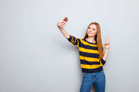 People digital device gadget teenager long-haired concept. Portrait of careless pretty charming...