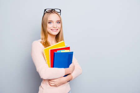 Teen age people style stylish trend person scholarship work worker assistant blonde hair concept. Portrait excited confident lovely cheerful pretty clever girl isolated on gray background copy-spaceの写真素材