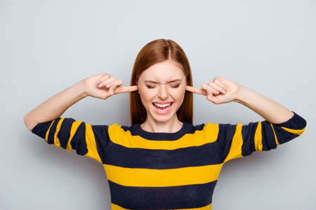 Negative mood pms scream routine failure loser headache struggle concept. Portrait of sad unhappy upset disappointed frustrated shouting exhausted manager closing ears isolated on gray backgroundの写真素材