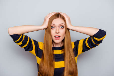 Head holding touching hipster university education model studying fortune luck concept. Portrait of glad excited cheerful shocked wondered teenager manager businesswoman isolated on gray backgroundの写真素材